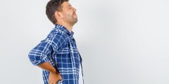 ألم أسفل الظهر بعد عملية تجريف البروستاتا: الأسباب والعلاج
